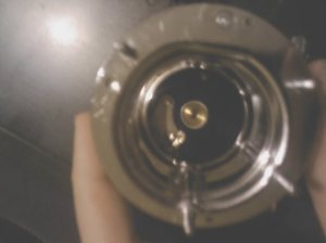 6. Looking straight in to the reel from the drive side, with the drive side plate removed. Shows the brass "bullet" in to which the spindle goes, and the components of the ratchet. 6. Looking straight in to the reel from the drive side, with the drive side plate removed. Shows the brass "bullet" in to which the spindle goes, and the components of the ratchet.